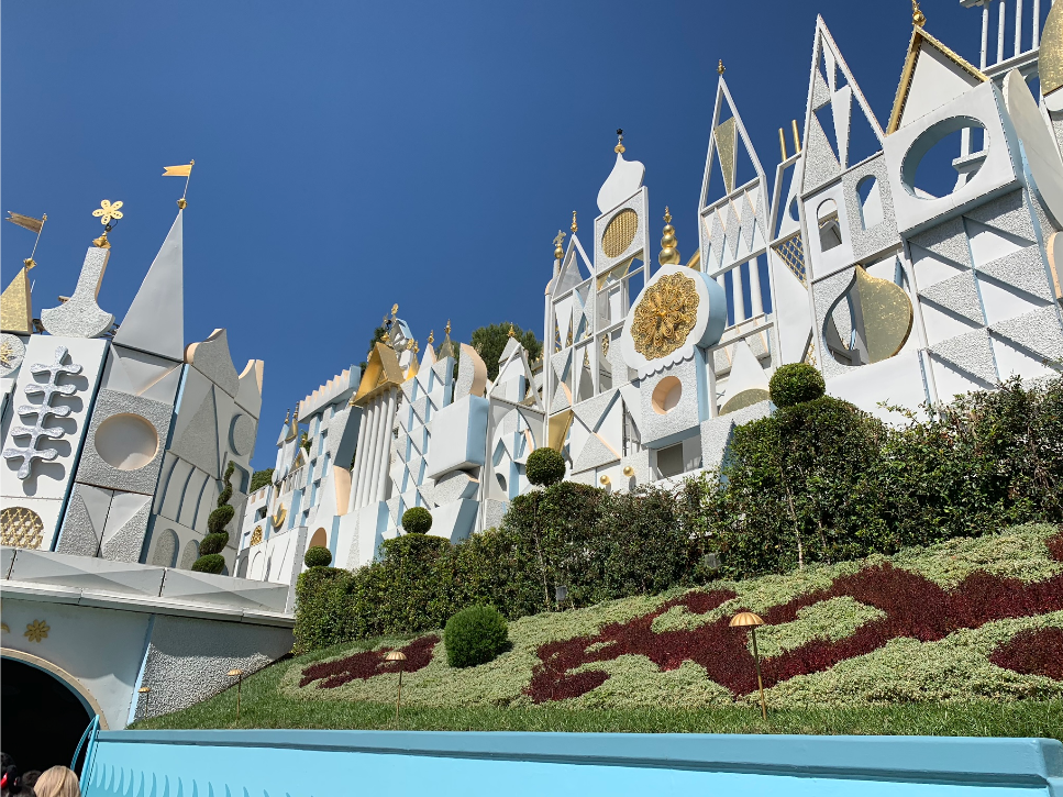 The front façade of it's a small world at Disneyland - Creating Disney Magic - Disney Parks Landscapes