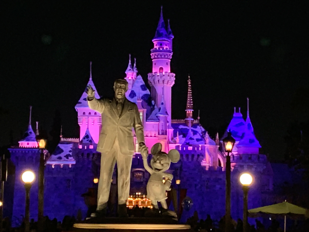 Partners Statue and Sleeping Beauty Castle at night - Disneyland - Disney Things We're Most Thankful For
