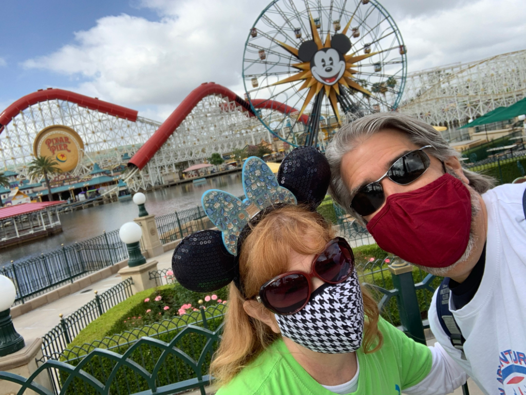 Tom and Michelle with Pixar Pier in the background - Our Return To Disneyland For Re-Opening Weekend