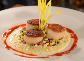 A plate of delicious seared scallops - Our Foodie Episode - New Disney Dining Experiences & Updates