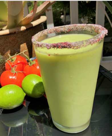 Avocado Margarita in tall glass with Hibiscus salt along the rim