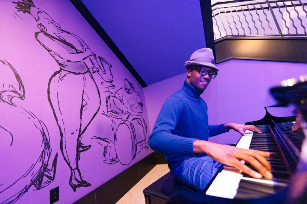 Unveiling the Magic: Pixar Place Hotel. Image of piano player as Joe Gardner