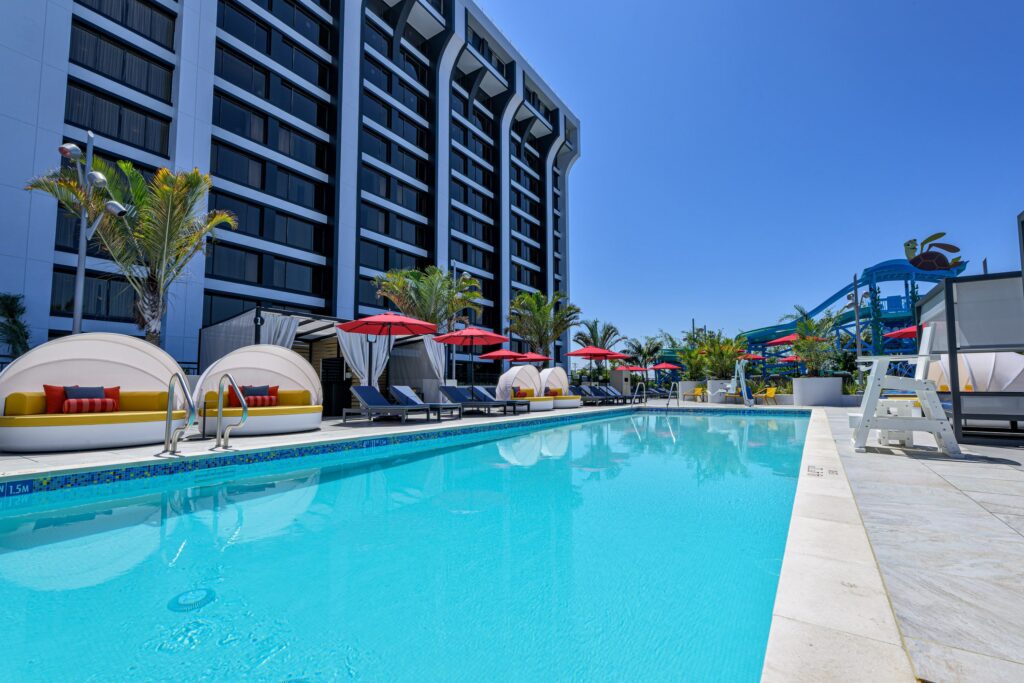 Unveiling the Magic: Pixar Place the Pool deck with cabanas and lounge chairs.