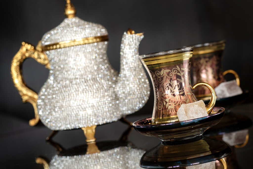 Bejeweled teapot and gold accented teacup